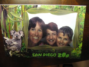Zoo staffers took our photo which I was going to buy in electronic form until I found out it was $45! So we went in a photo booth ($5) at the zoo, and I took a picture of the bent-up photo when we got home.