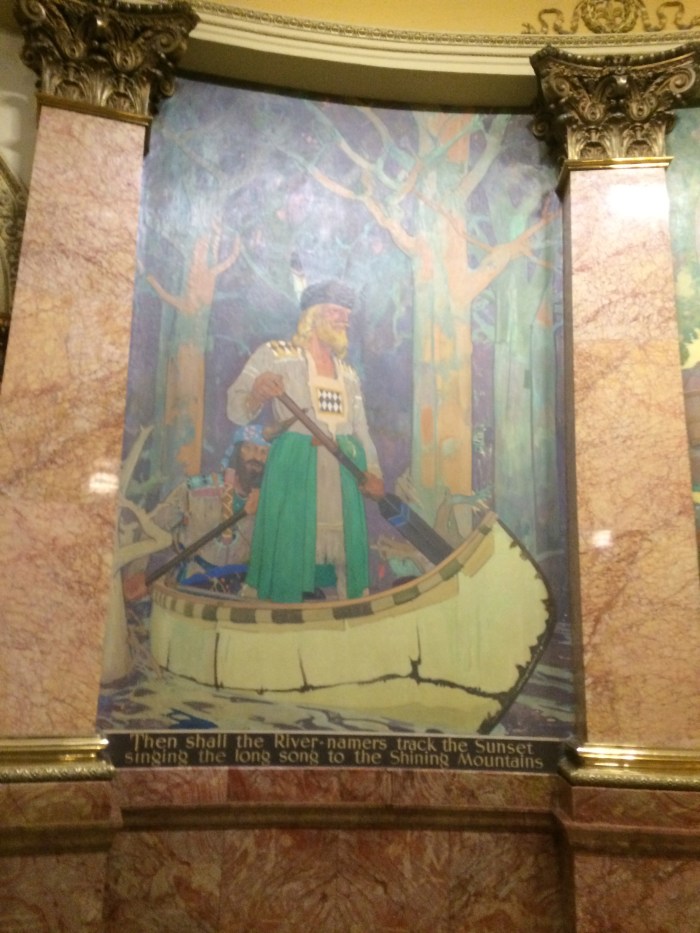 There are some crazy murals at the capitol that we never noticed before today.  Underneath each of the eight paintings there's a  silly, non-sensical verse.  I'm not sure what's being portrayed here...viking wearing a dress and coon-skin cap in a canoe with a Mediterranean guy behind him...