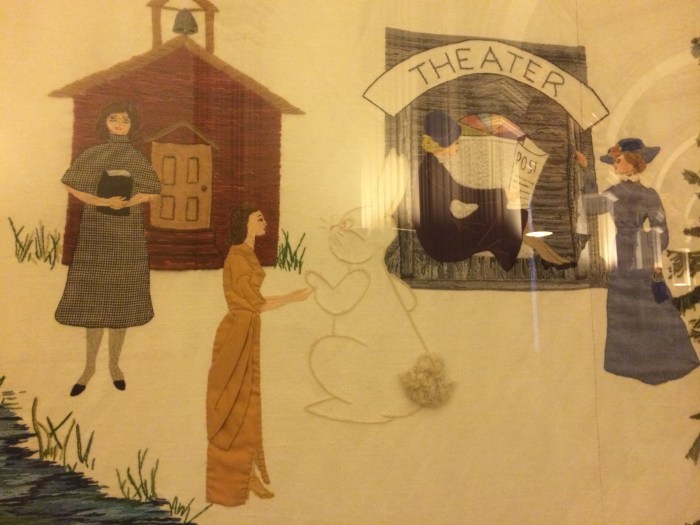 Laurel said, "Oh, I remember I really liked this quilt when I was younger (It features Colorado women through the ages.), but now I realize how weird it is, especially with this woman shaking hands with a giant rabbit.  Why does it seem like all the artwork here was done by people who were high?"