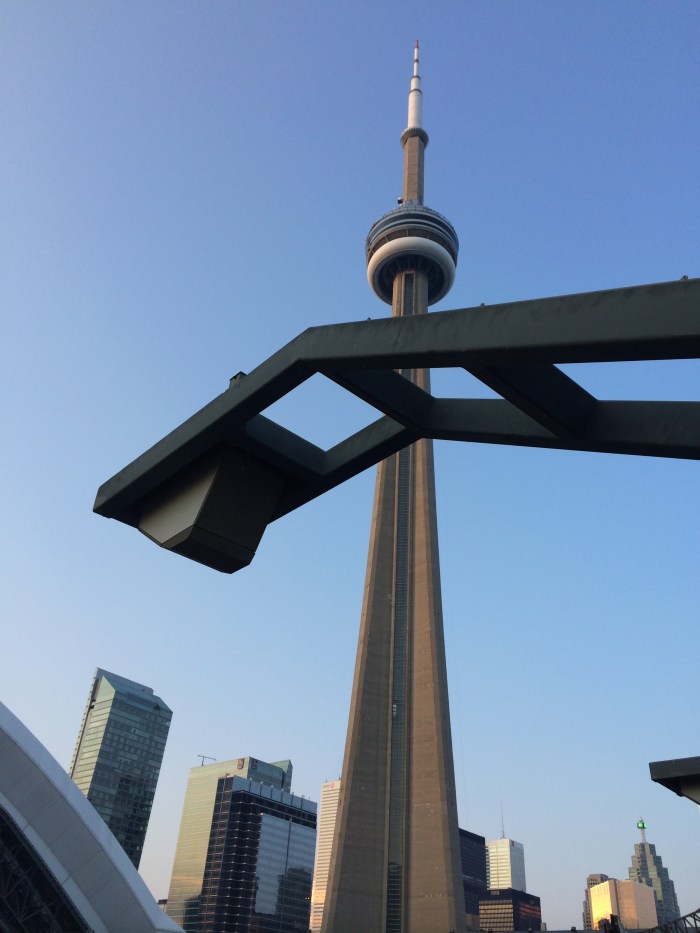The CN Tower is right next to the baseball stadium.  As we watched the game, we could also watch the tower change colors (as night came on and the tower was lit up) and watch people who were strapped on to the tower do the Edge Walk.
