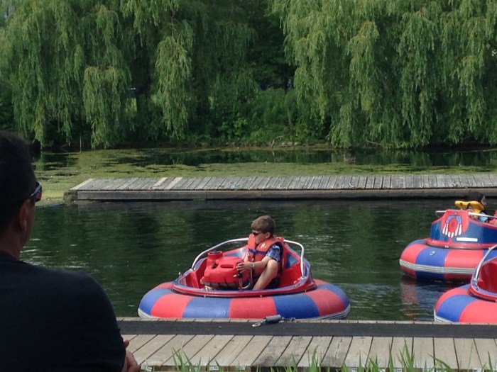 Charlie got to ride in a bumper boat at Centreville the second time he went.