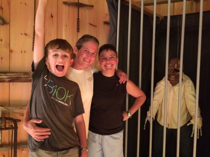 Charlie, Margaret, Nina The scary guy behind bars is something that Margaret made for the Halloween party last year and is still in their barn.