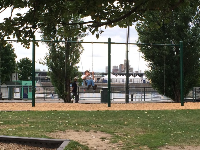 Charlie plays air bass while swinging