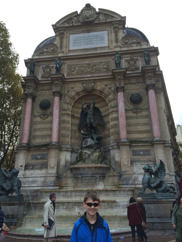 St. Michael/Michel the Archangel slaying the devil - There is a plaque next to it dedicated to the French soldiers who died defending Paris in 1944.